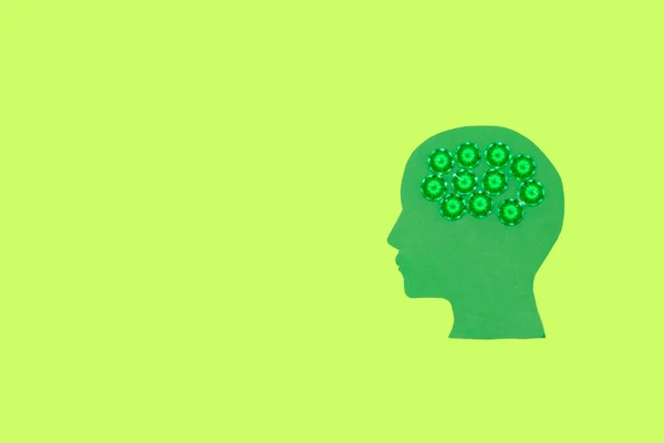 ecological design, green head with green brain on green background, copy space, creative art design