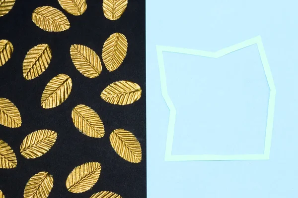 black blue background, on the black part golden leaves, on the blue blue frame as copy space, creative art design