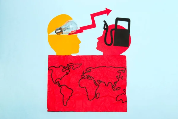 global energy crisis, paper heads with bulb and fuel pump, red arrow, crisis