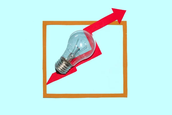 bulb with red arrow in frame on blue background, global energy crisis