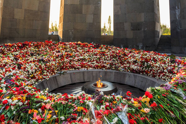 Flowers near the "eternal fire" on the territory of The Armenian Genocide Memorial complex in Yerevan. Armenia