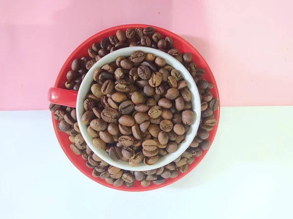 Coffee Beans Glass Pink Background — стоковое фото