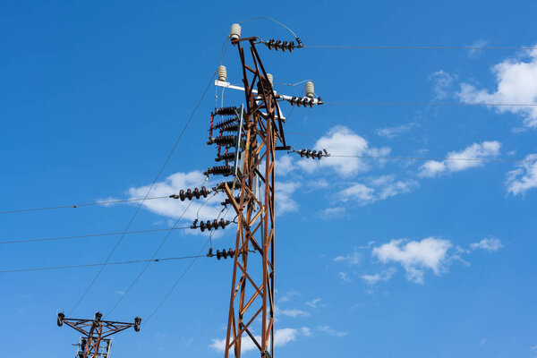 high voltage tower with blue sky