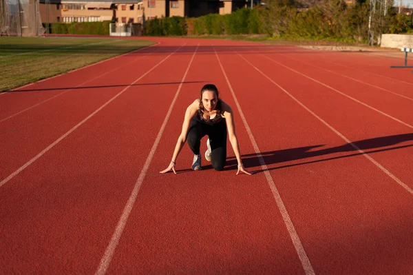 Young Sportsman Running Track Doing Stretching Exercises — Foto de Stock