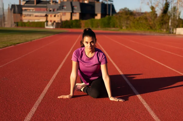 Young Sportsman Running Track Doing Stretching Exercises — Foto de Stock