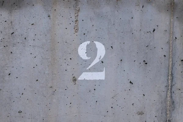 Number Painted Worn Concrete Wall Centered — Stockfoto