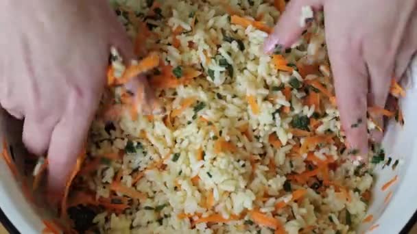 Woman Mixes Rice Carrot Salad Her Hands Large Bowl Rice — Stock Video