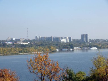View from the shores of the island of Khortytsia on the Dnieper industrial city of Zaporozhye covered with a cloud of factory emissions on the horizon.