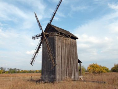 Ancient Cossack mill in southern Khortytsia on a background of sunny barely cloudy sky.