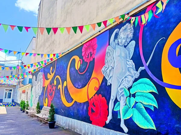 The incredible beauty of the street art on the walls of the houses in the narrow streets of the old part of the city invites you to rest in the shade and admire the paintings.