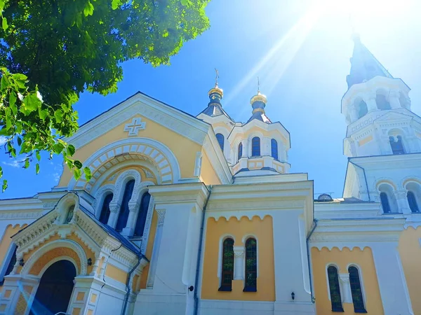 The sun\'s rays that fall on the crosses of the Orthodox Cathedral and are reflected from its gilded towers give the impression that the sunny Lord is looking down on us.