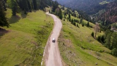 top view of a passenger car that is driving on a mountain road in Georgia