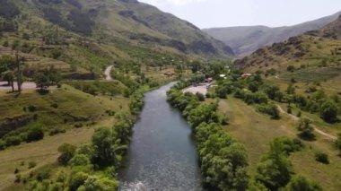 drone flight along a narrow mountain river in Georgia