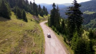 top view of a passenger car that is driving on a mountain road in Georgia