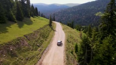 top view of a passenger car that is driving on a mountain road in Georgia