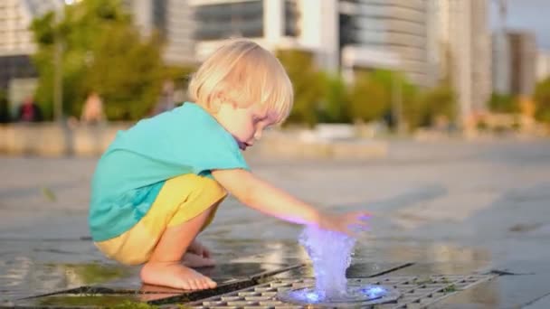 Boy Splashes Water Fountain Baby Wet Happy Slow Motion High — Stockvideo