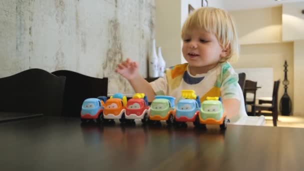 Happy Child Has Fun Playing Colorful Car Table Restaurant Kindergarten — Stok video