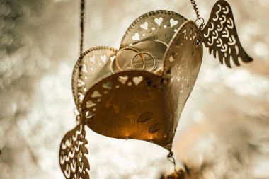 wedding rings in the suspension heart with wings