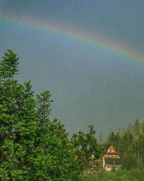 Rainbow in the dark gray sky