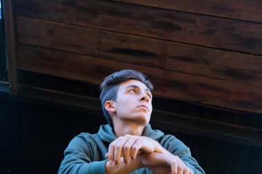 Handsome young man portrait in outdoor. Alternative lifestyle.