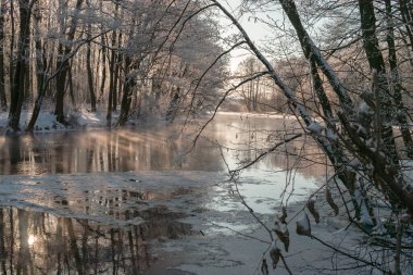 smoke on the river on a sunny winter day
