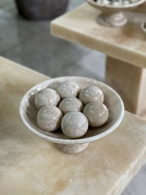 The container made of marble is like a plate