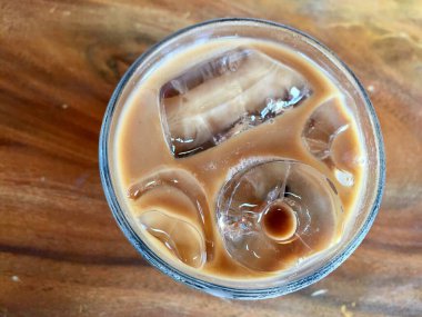 a glass of iced coffee seen from above