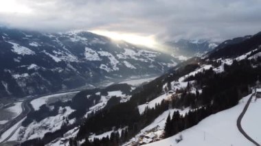 Austrian Alps Cold Mountain Top Snow Mountains Peaks Landscape Drone Aerial Flight drone flyover the mountains and skiing village
