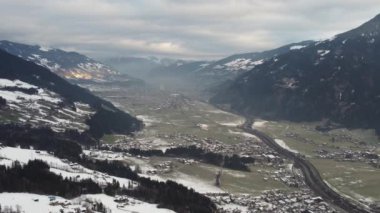 Austrian Alps Cold Mountain Top Snow Mountains Peaks Landscape Drone Aerial Flight drone flyover the mountains and skiing village