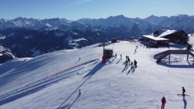 Austrian Alps Cold Mountain Top Snow Mountains Peaks Landscape Drone Aerial Flight drone flyover the mountains and skiing village