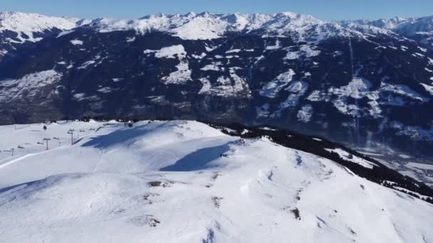 Austrian Alps Cold Mountain Top Snow Mountains Peaks Landscape Drone Aerial Flight drone flyover the mountains and skiing village — Stockvideo