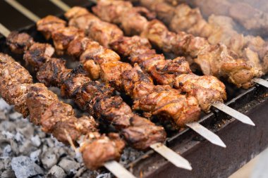 delicious and fragrant meat, skewers on grill 