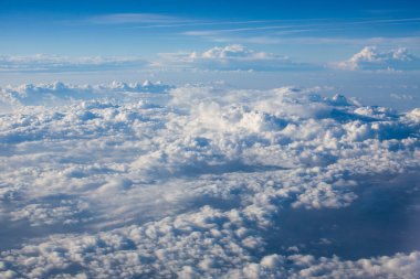 beautiful fluffy clouds from the window of the plane