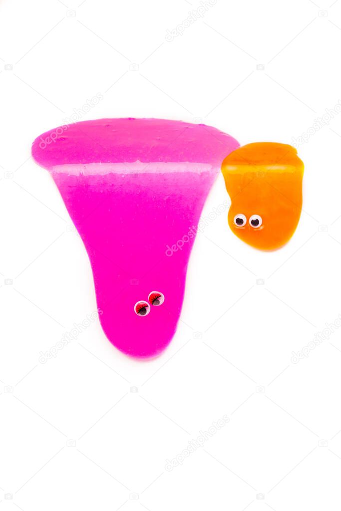 a toy for children mucus and liquid flowing which has eyes on white background 