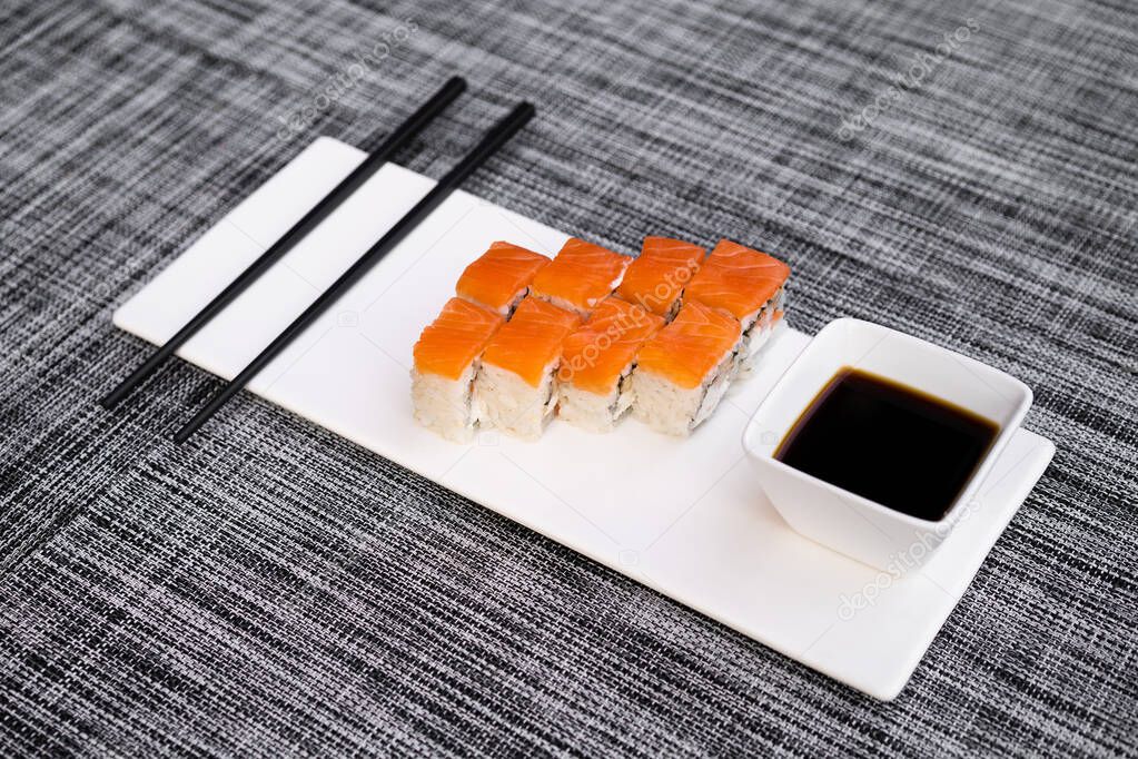 a dish of delicious sushi rolls
