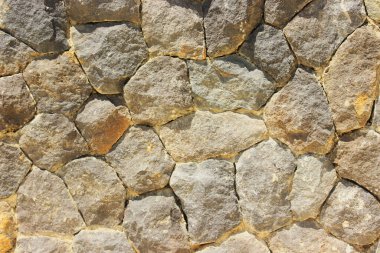 Taş duvar dokusu. Taş duvar arka plan dokusu olarak kullanılıyor. Doku veya arka plan için taş duvarın bir parçası. Taş üstüne yıldırım