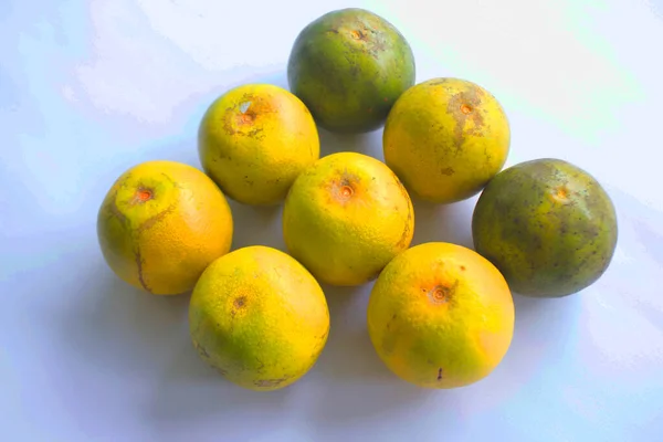 fresh lemon slice, orange slice, jeruk baby, citrus sinensis, green lemon, yellow lemon in white background