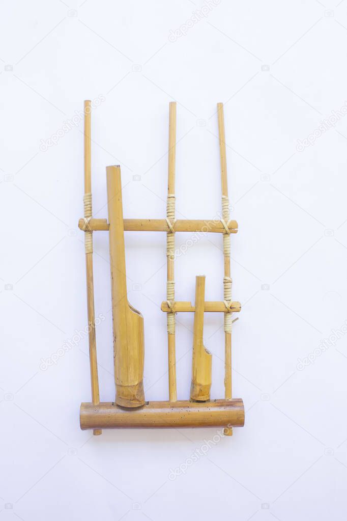 Angklung, the traditional sundanese musical instrument made from bamboo. Isolated on white background