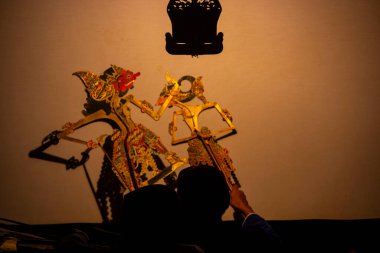 wayang kulit or shadow puppets from Java, Indonesia puppet show by dalang or puppeteer . Wayang made from leather