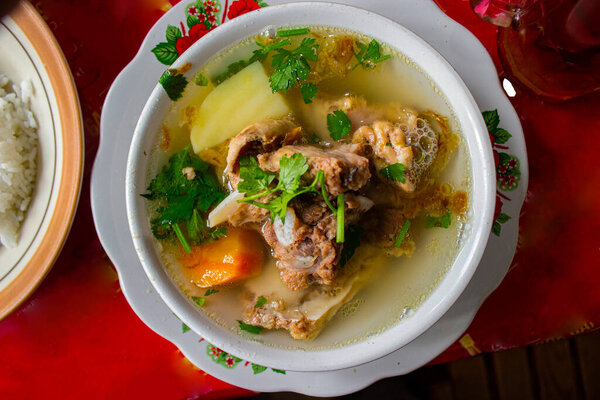 sop buntut or oxtail soup or tail soup is traditional soup made from tail ox, Boiled with Spices