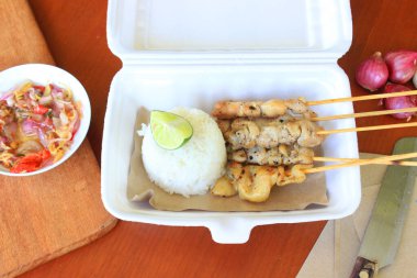 sate taichan or taichan satay , made from chicken meat, served with Sauce, Ketchup and lime. this food like yakitori