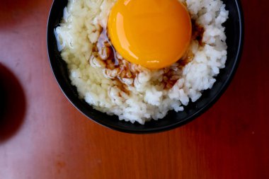 tamago kake gohan or raw egg on rice. traditional food from japan, eat on breakfast