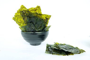 nori seaweed isolated on white background. Japanese food nori. Dry seaweed sheets.
