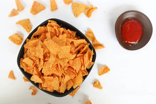 tortilla chip is corn chips or call nachos, served in bowl, on black background made from corn