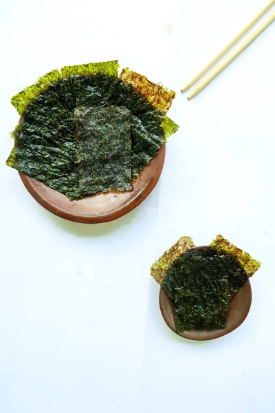 nori seaweed isolated on white background. Japanese food nori. Dry seaweed sheets.