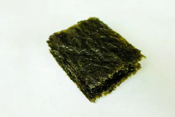 nori seaweed isolated on white background. Japanese food nori. Dry seaweed sheets.