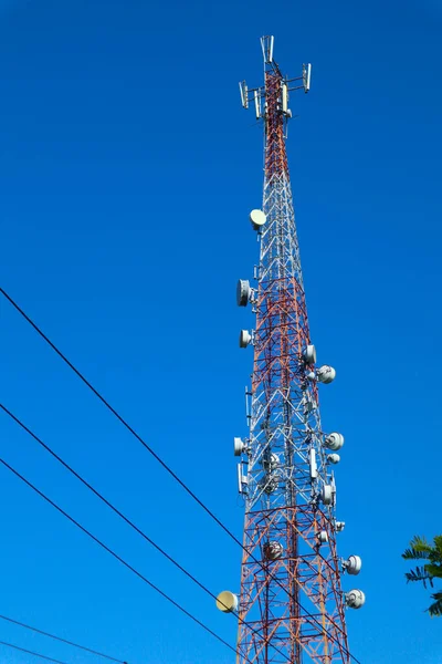 communication tower. Telco Trellis for 3G 4G 5G Apocalypse Internet Communication, mobile, FM Radio and Television Broadcasting On Air with Blue Sky in Background