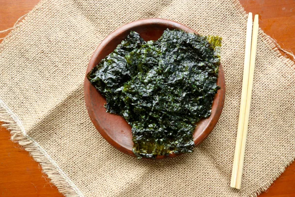 nori seaweed isolated on white background. Japanese food nori. Dry seaweed sheets.