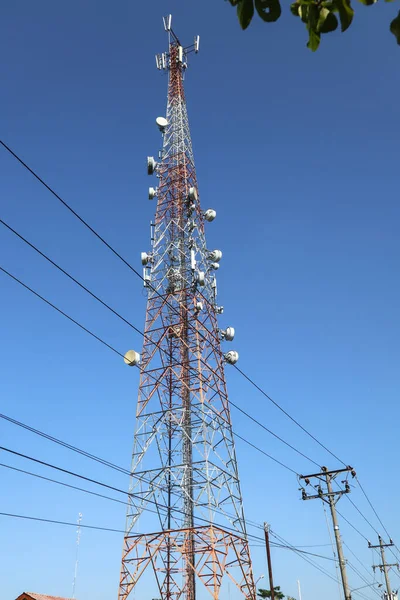 communication tower. Telco Trellis for 3G 4G 5G Apocalypse Internet Communication, mobile, FM Radio and Television Broadcasting On Air with Blue Sky in Background