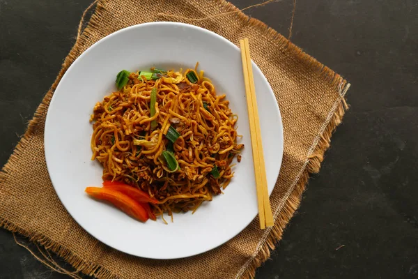 yakisoba is traditional stir fried noodle japan, made from noodles, cabbage, vegetables and meat, seasoning with oyster sauce or yakisoba sauce. yakisoba served on plate